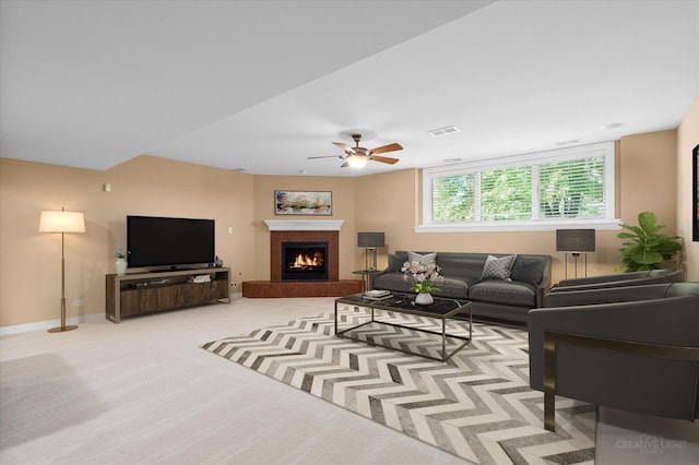 13150 S Lake Mary Dr, Plainfield, IL 60585 - living room featuring ceiling fan, a warm lit fireplace, light carpet, and baseboards