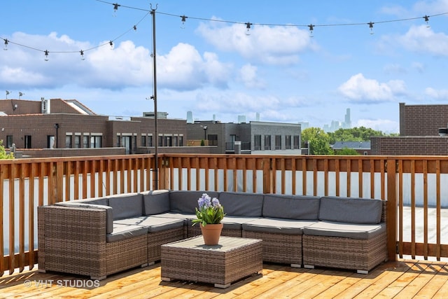 wooden terrace featuring outdoor lounge area