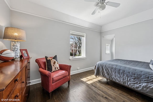 bedroom with baseboards, ceiling fan, and dark wood-type flooring