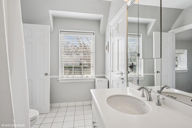 bathroom with tile patterned flooring, baseboards, toilet, and vanity