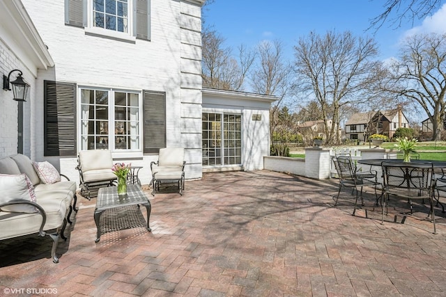 view of patio with an outdoor hangout area and outdoor dining area