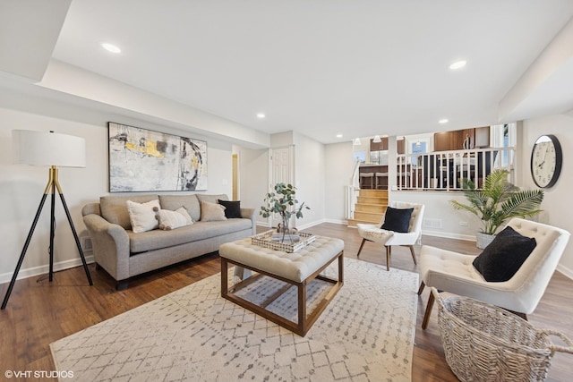 living room featuring baseboards, recessed lighting, dark wood-style floors, and stairway