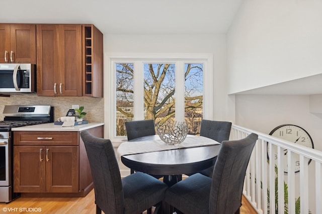 dining space with light wood-style flooring