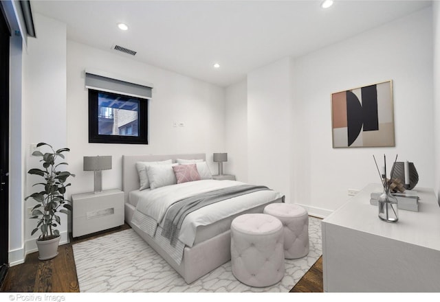 bedroom featuring recessed lighting, wood finished floors, and visible vents