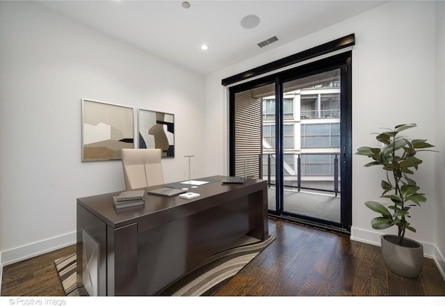 office space featuring visible vents, baseboards, recessed lighting, and dark wood-style floors