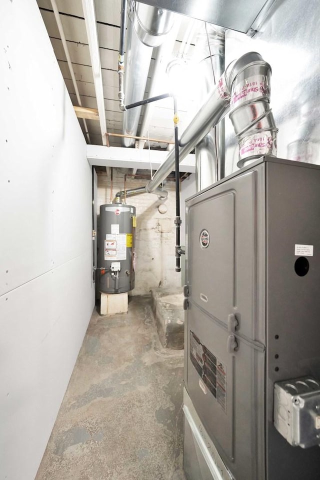 utility room featuring gas water heater