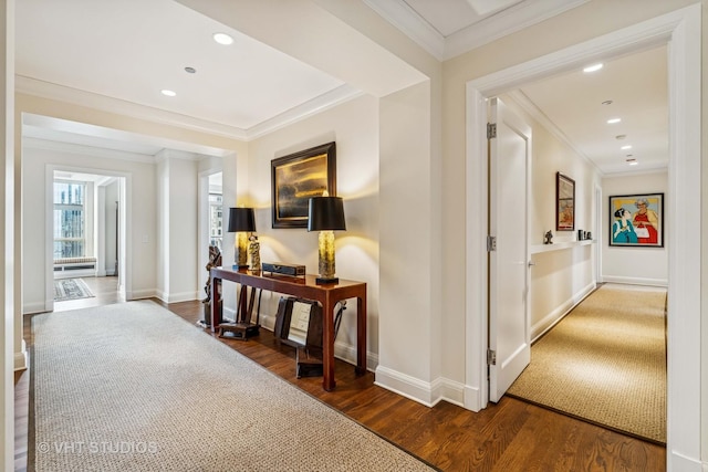hall featuring crown molding, baseboards, recessed lighting, and wood finished floors