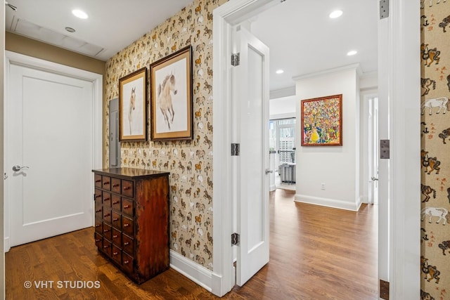 corridor featuring dark wood-type flooring, recessed lighting, baseboards, and wallpapered walls