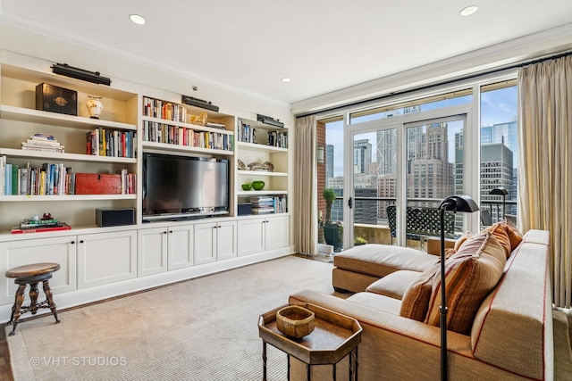 living area featuring crown molding, recessed lighting, and built in shelves