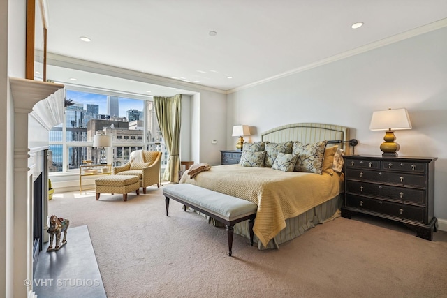bedroom with carpet flooring, a view of city, crown molding, and a fireplace with flush hearth