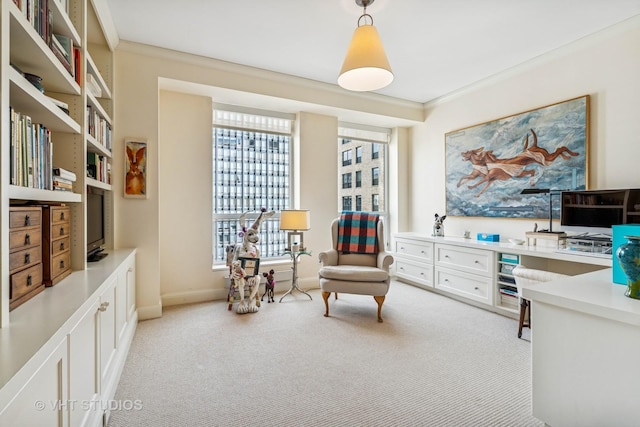 living area with crown molding, baseboards, and light carpet
