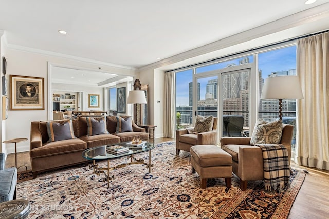 living room featuring a view of city, ornamental molding, a wealth of natural light, and wood finished floors