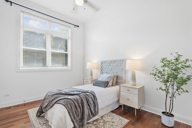bedroom featuring baseboards, dark wood-type flooring, and a ceiling fan