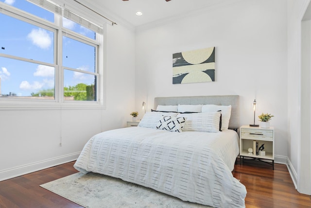 bedroom with wood finished floors, baseboards, multiple windows, crown molding, and recessed lighting