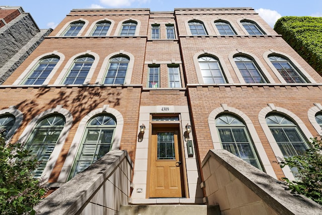 multi unit property featuring brick siding