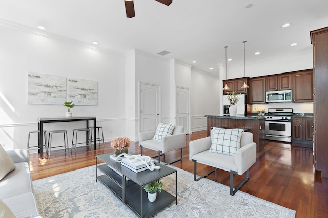 living room featuring ornamental molding, dark wood-type flooring, ceiling fan, and recessed lighting