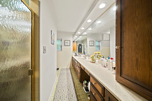 full bath featuring tile walls, recessed lighting, visible vents, tile patterned floors, and vanity