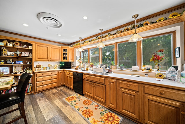 kitchen with light countertops, a sink, decorative light fixtures, dishwasher, and ornamental molding
