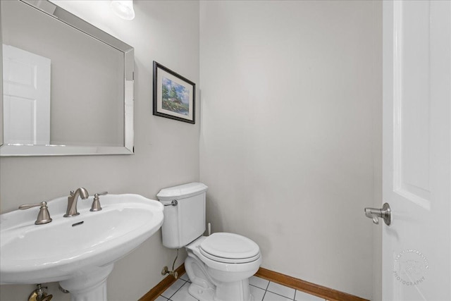 1651 Eagle Brook Dr, Geneva, IL 60134 - bathroom with toilet, tile patterned floors, a sink, and baseboards