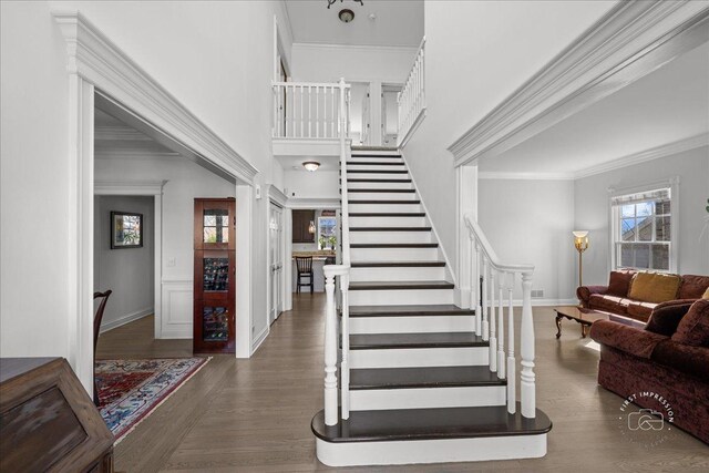 1651 Eagle Brook Dr, Geneva, IL 60134 - entryway with baseboards, wood finished floors, stairs, and crown molding