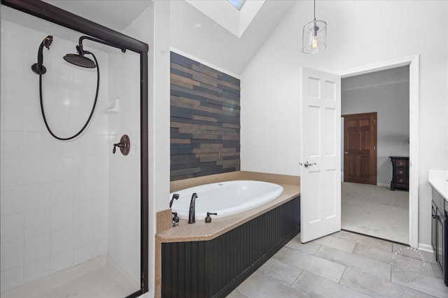1651 Eagle Brook Dr, Geneva, IL 60134 - bathroom with a bath, tile patterned flooring, lofted ceiling with skylight, and a stall shower