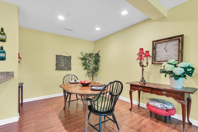 dining space featuring baseboards, recessed lighting, wood finished floors, and visible vents
