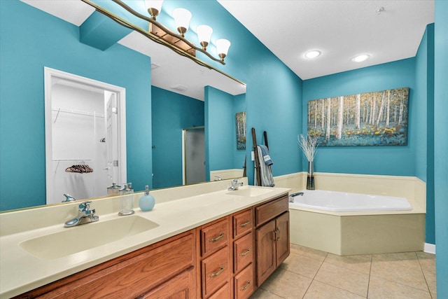 bathroom featuring a sink, tile patterned floors, double vanity, and a walk in closet
