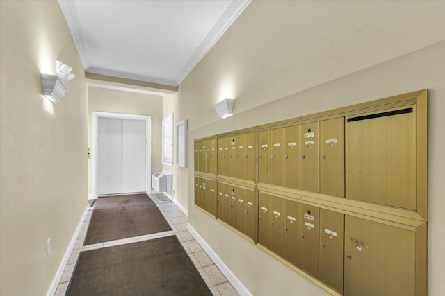 hall with ornamental molding, baseboards, a wall mounted air conditioner, mail area, and tile patterned floors