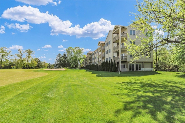 view of community featuring a yard