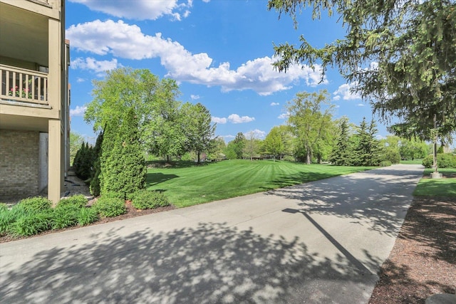 surrounding community with a yard
