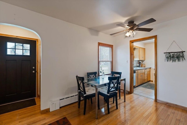 418 Bonnie Brae Ave, Itasca, IL 60143 - dining space featuring light wood-style floors, a healthy amount of sunlight, a ceiling fan, and baseboard heating