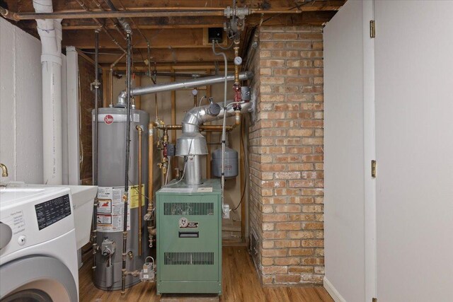 418 Bonnie Brae Ave, Itasca, IL 60143 - utility room featuring water heater, a heating unit, and washer / dryer