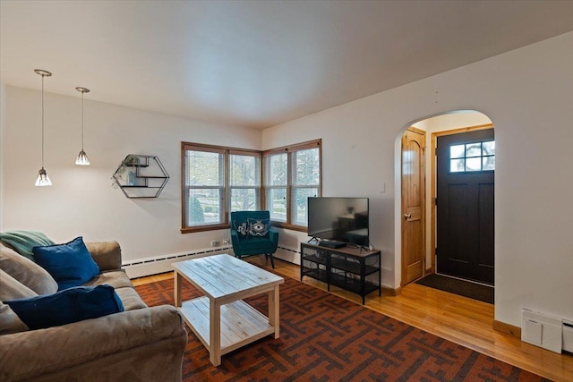 418 Bonnie Brae Ave, Itasca, IL 60143 - living room with baseboard heating, wood finished floors, and arched walkways