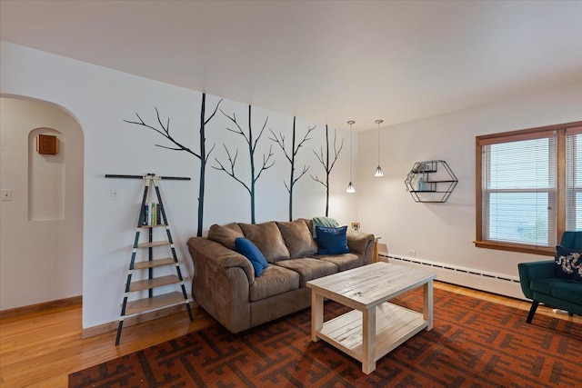 418 Bonnie Brae Ave, Itasca, IL 60143 - living room featuring baseboard heating, wood finished floors, and arched walkways