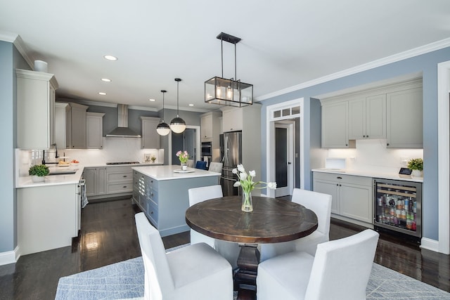 dining area with ornamental molding, dark wood-type flooring, wine cooler, and recessed lighting