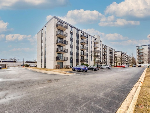 view of property featuring uncovered parking