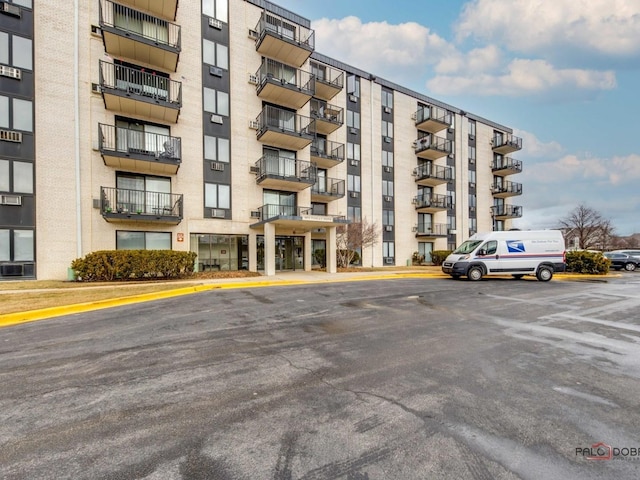 view of property featuring uncovered parking