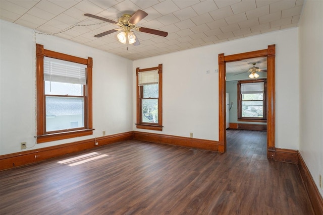 765 N Main St, Pontiac, IL 61764 - spare room with dark wood-type flooring, ceiling fan, and baseboards