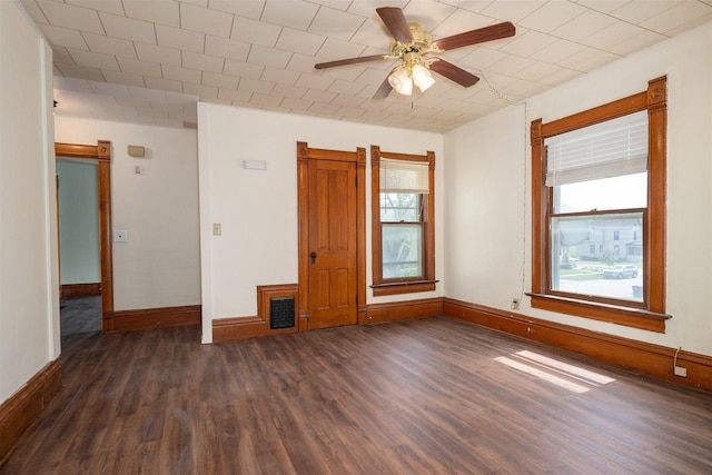 765 N Main St, Pontiac, IL 61764 - empty room with a ceiling fan, dark wood finished floors, and baseboards
