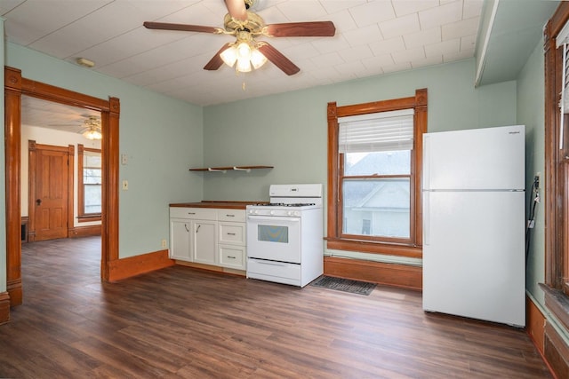 765 N Main St, Pontiac, IL 61764 - kitchen featuring a ceiling fan, white appliances, white cabinets, and dark wood-type flooring