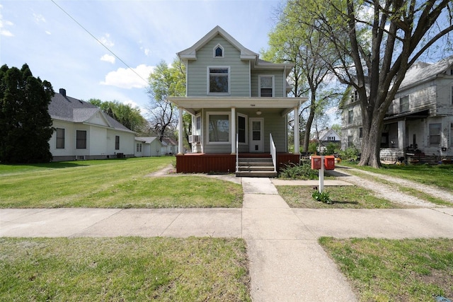 765 N Main St, Pontiac, IL 61764 - view of front of home featuring a front lawn and covered porch