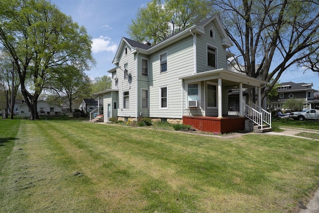765 N Main St, Pontiac, IL 61764 - view of side of property featuring a yard and a porch
