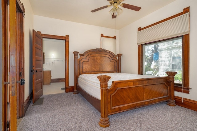 765 N Main St, Pontiac, IL 61764 - carpeted bedroom featuring a ceiling fan, visible vents, connected bathroom, and baseboards