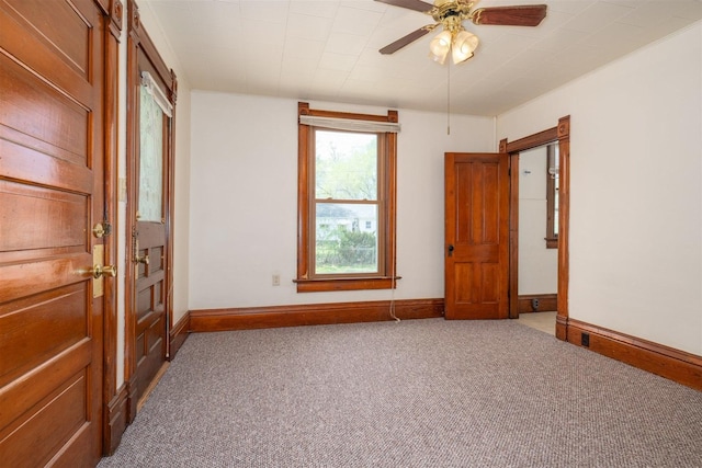 765 N Main St, Pontiac, IL 61764 - empty room with baseboards, ceiling fan, and carpet floors