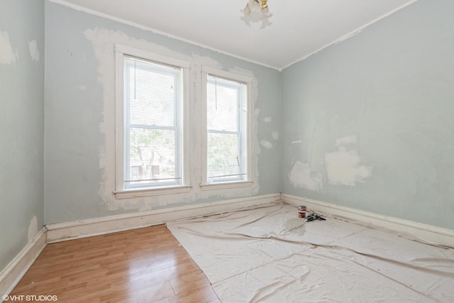 5433 S Carpenter St, Chicago, IL 60609 - unfurnished room featuring ornamental molding, baseboards, and wood finished floors