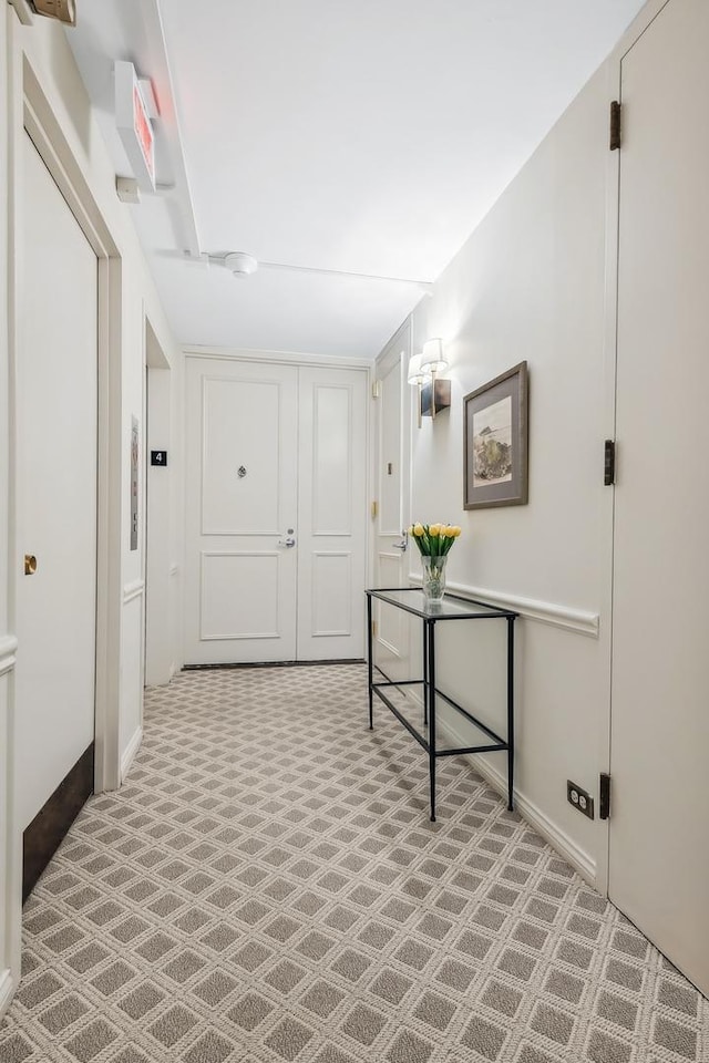 corridor featuring baseboards