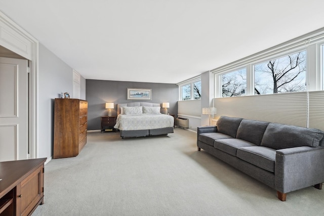 bedroom featuring light colored carpet