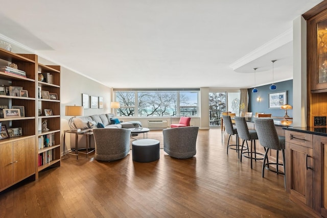 living area with plenty of natural light, dark wood finished floors, and crown molding