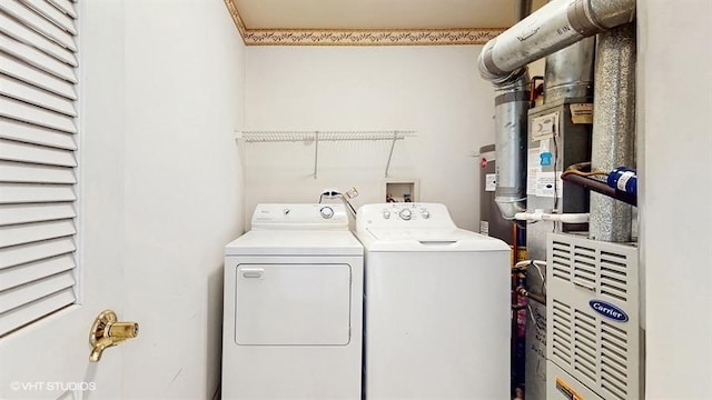 washroom featuring separate washer and dryer and laundry area