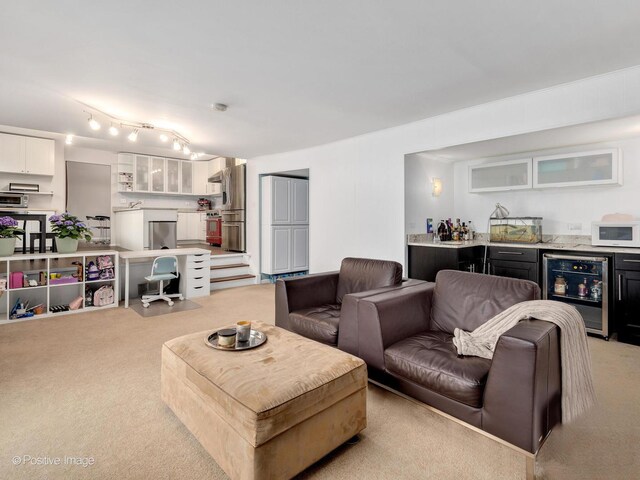 kitchen featuring baseboards, open shelves, white cabinetry, and light countertops